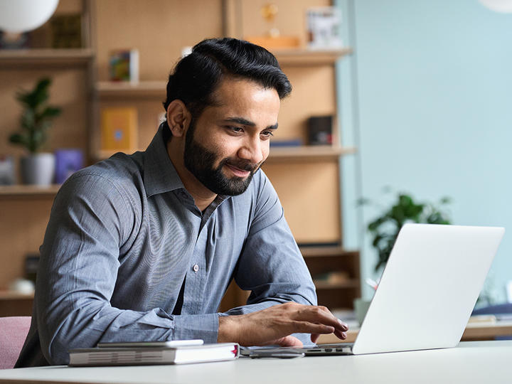 man looking at a laptop screen